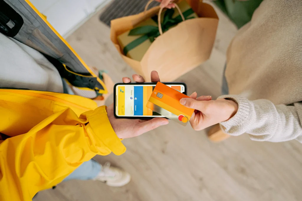 Customer withdrawing cash from an ATM inside an Illinois small business to make impulse purchases.